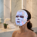 Paloma Beauties LED Face Mask — lifestyle shot with glowing blue and red LEDs